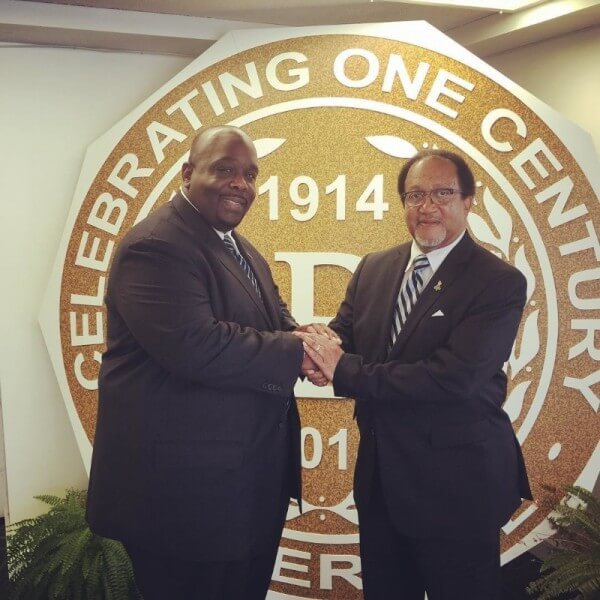 Shown in photo: Jonathan A. Mason, Sr. (left) and Dr. Benjamin Chavis (right). Mason shakes Dr. Chavis hands after presenting him with the keys for Phi Beta Sigma Fraternity, Inc. Headquarters, which will serve as the National Mobilization Headquarters for the 20th Anniversary of the Million Man March. (PRNewsFoto/Phi Beta Sigma Fraternity, Inc.)