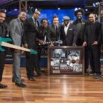 LATE NIGHT WITH JIMMY FALLON -- Episode 819 -- Pictured: (center) Jimmy Fallon presents the Roots (l-r) Mark Kelley, Damon "Tuba Gooding Jr." Bryson, F. Knuckles, Captain Kirk Douglas, Black Thought, Questlove, Kamal Gray, James Poyser with a plaque commemorating their first RIAA-certified platinum album for their 1999 release, "Things Fall Apart" on April 22, 2013 -- (Photo by: Lloyd Bishop/NBC/NBCU Photo Bank via Getty Images)