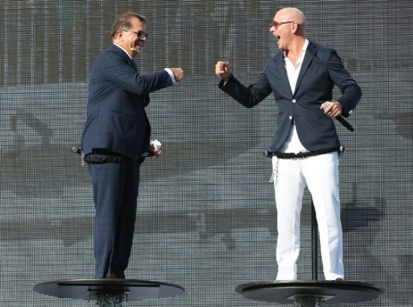 Frank Del Rio and Pitbull celebrate with onstage "fist bump" at the Norwegian Escape christening ceremony. (PRNewsFoto/Norwegian Cruise Line)