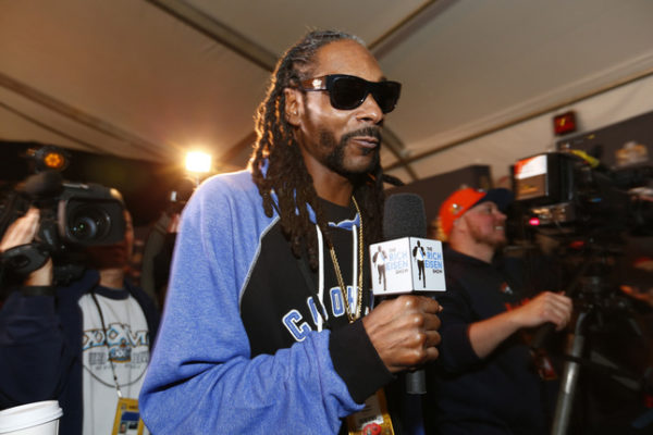 Rapper Snoop Dogg walks the room as he interviews Denver Bronco players during the Broncos daily press conference at the Santa Clara Marriott Hotel in Santa Clara, Calif., on Thursday, Feb. 4, 2016. The Denver Broncos prepare to play the Carolina Panthers in Super Bowl 50. (Gary Reyes/Bay Area News Group)