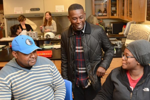 GZA chatting with students about DNA models they were constructing. (PRNewsFoto/Bunker Hill Community College)