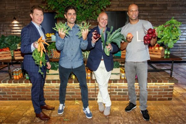 Bobby Flay, Adrian Grenier, Tom Colicchio and Common snap a fruit and vegetable selfie at Naked Juice&apos;s #DrinkGoodDoGood campaign launch event in Manhattan. For every selfie shared using the campaign hashtag, Naked Juice will donate 10 pounds of produce to communities in need. (PRNewsFoto/Naked Juice)